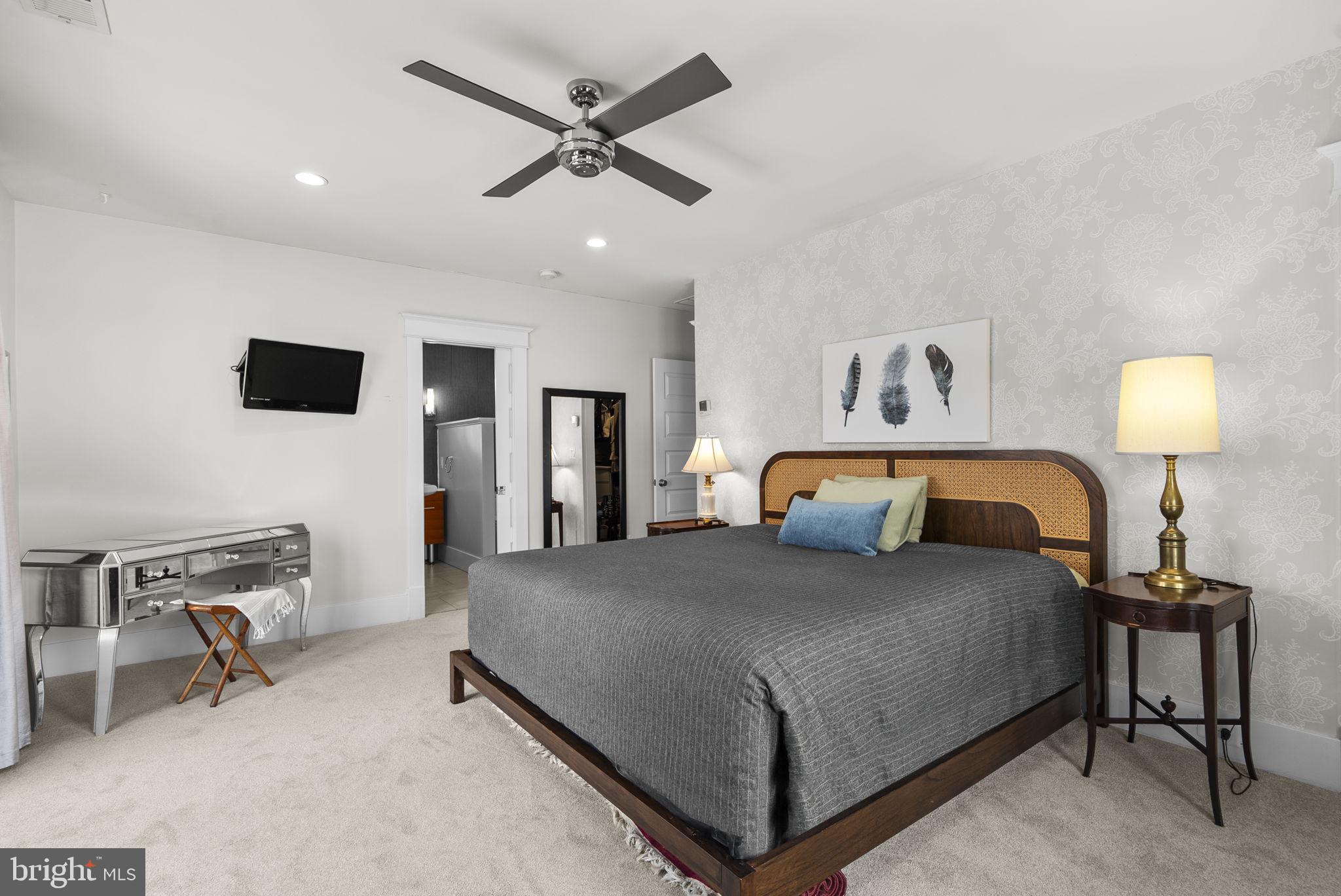1415 Ballard Street Silver Spring, MD 20910 - Photo 37 of 56 a bedroom with a bed a chair and potted plant on the table