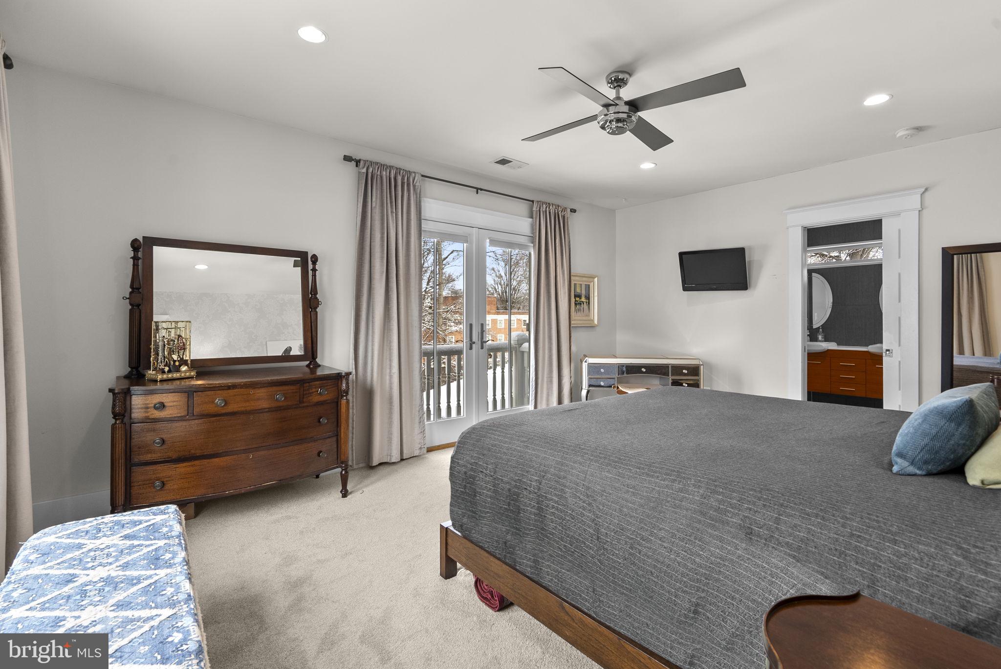 1415 Ballard Street Silver Spring, MD 20910 - Photo 38 of 56 a living room with a bed furniture flat screen tv and a large window