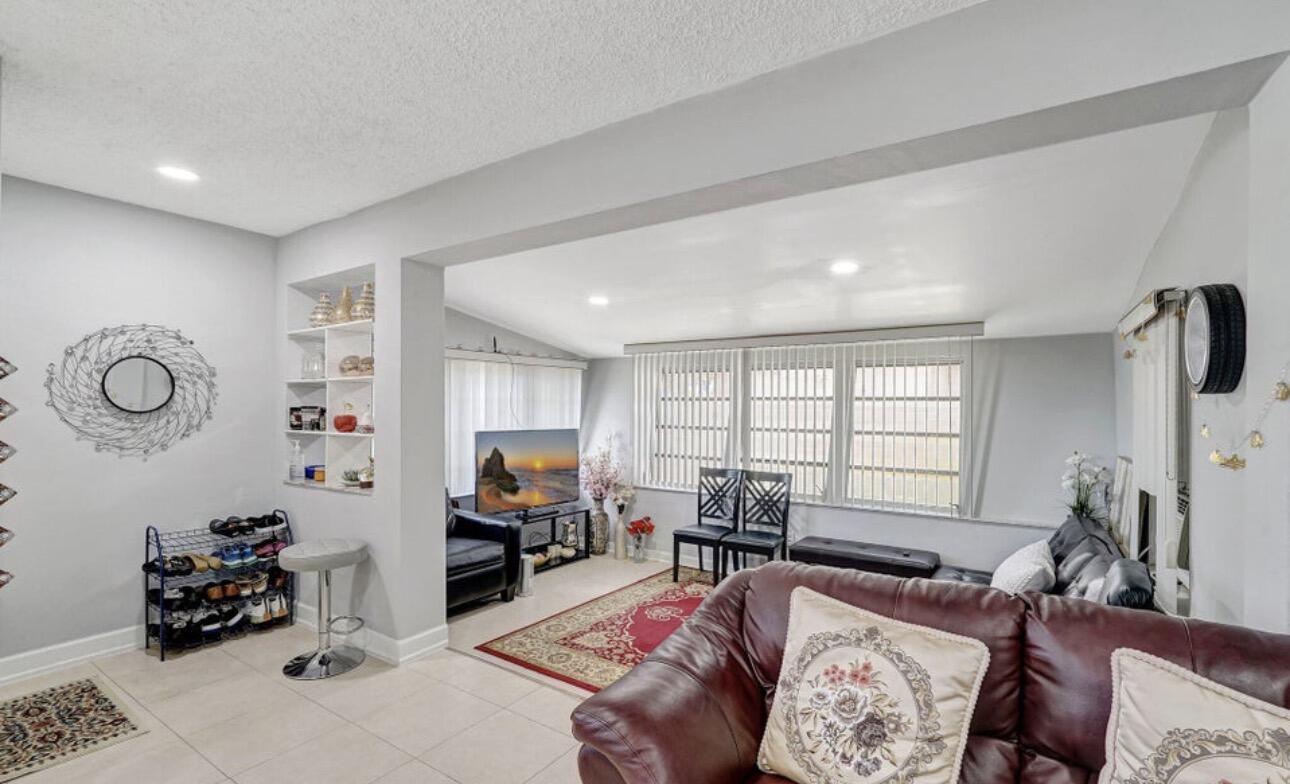 7530 Atlanta Street Hollywood, FL 33024 - Photo 12 of 23 a living room with furniture and a window