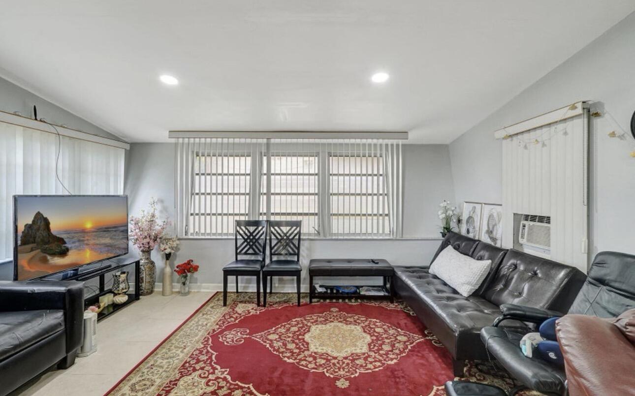 7530 Atlanta Street Hollywood, FL 33024 - Photo 13 of 23 a living room with furniture and a flat screen tv