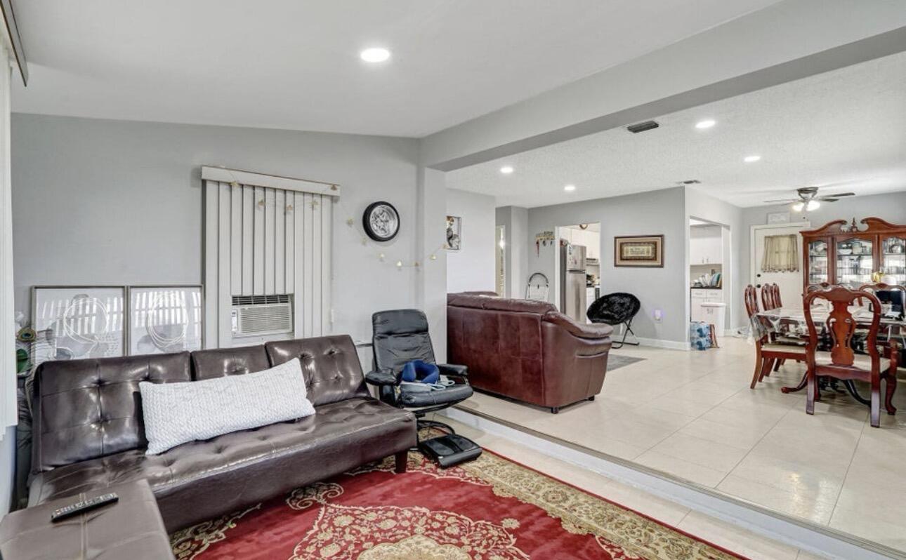 7530 Atlanta Street Hollywood, FL 33024 - Photo 15 of 23 a living room with furniture and a rug