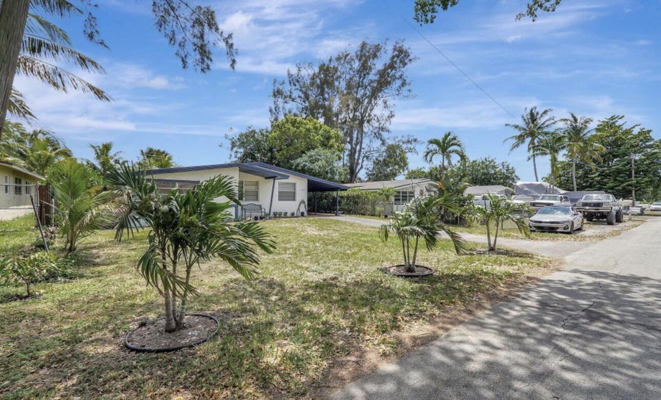 7530 Atlanta Street Hollywood, FL 33024 - Photo 2 of 23 a view of a yard with palm trees