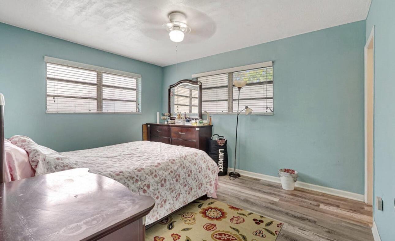 7530 Atlanta Street Hollywood, FL 33024 - Photo 22 of 23 a bedroom with a bed and a window