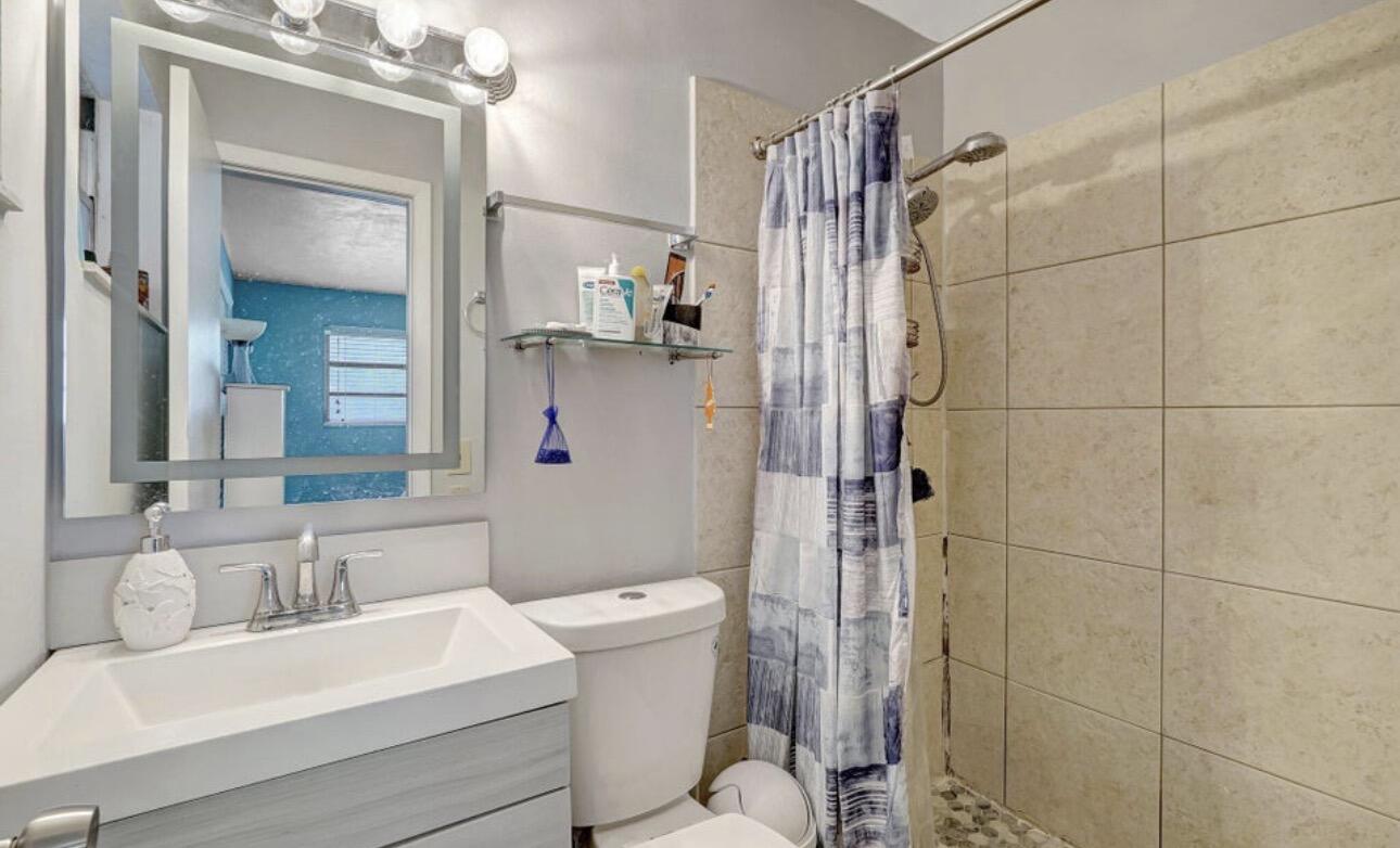 7530 Atlanta Street Hollywood, FL 33024 - Photo 23 of 23 a bathroom with a sink toilet and shower