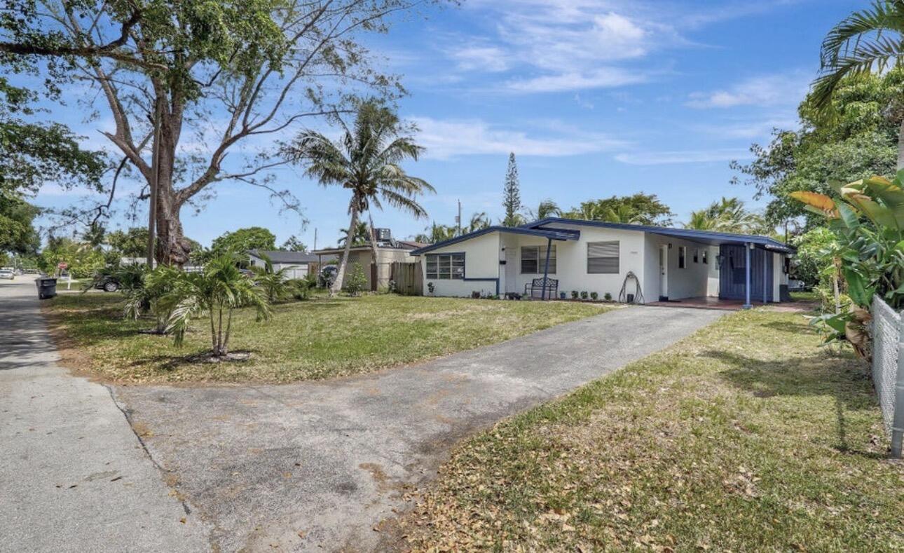 7530 Atlanta Street Hollywood, FL 33024 - Photo 3 of 23 a view of a house with a yard