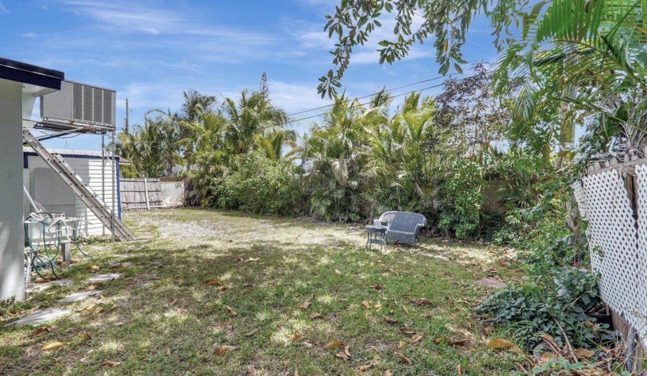7530 Atlanta Street Hollywood, FL 33024 - Photo 5 of 23 a view of a yard with table and chairs and potted plants