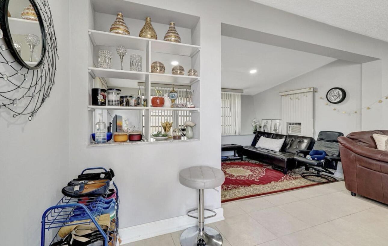 7530 Atlanta Street Hollywood, FL 33024 - Photo 9 of 23 a room with lots of furniture and decor