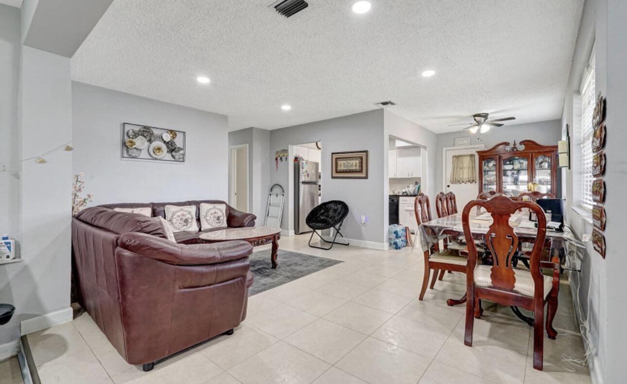 7530 Atlanta Street Hollywood, FL 33024 - Photo 10 of 23 a living room with furniture and a table