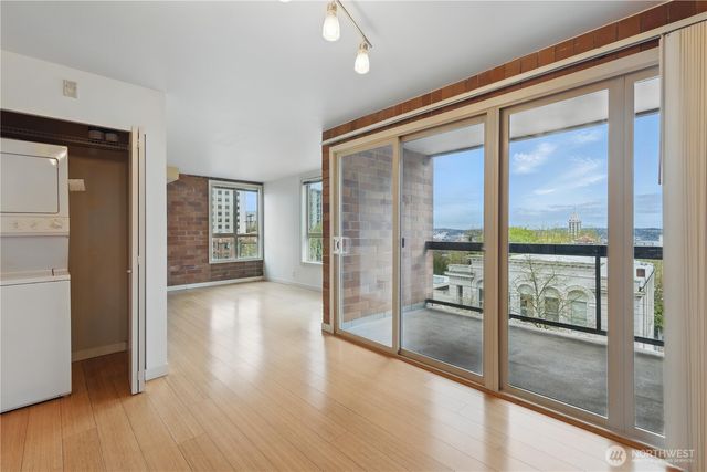 a view of an entryway with wooden floor