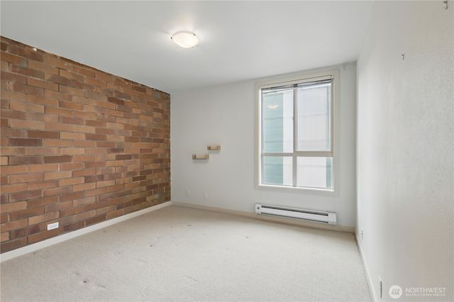 an empty room with a empty space and window