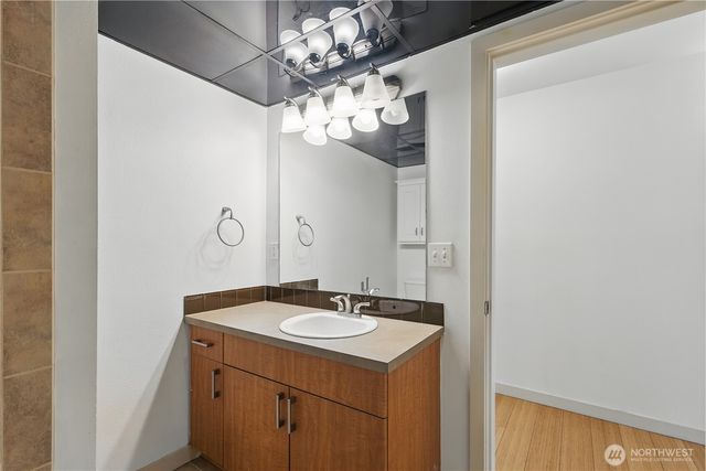 a bathroom with a sink and a mirror