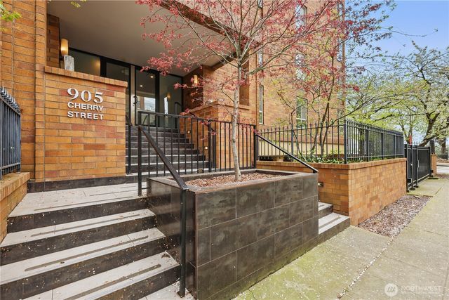a view of a brick building with many windows