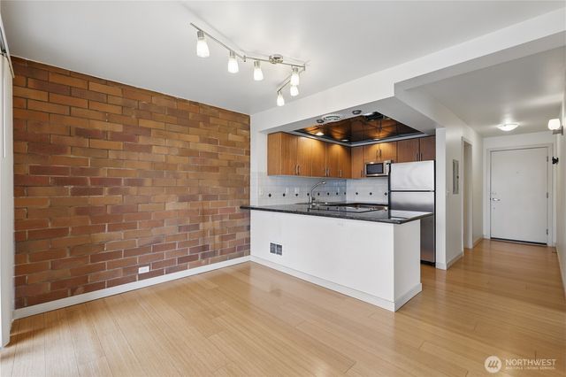 a bathroom with a mirror and a shower