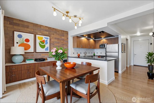 a kitchen with a table and chairs in it