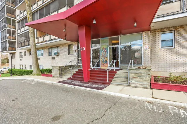 a view of a building with sitting area