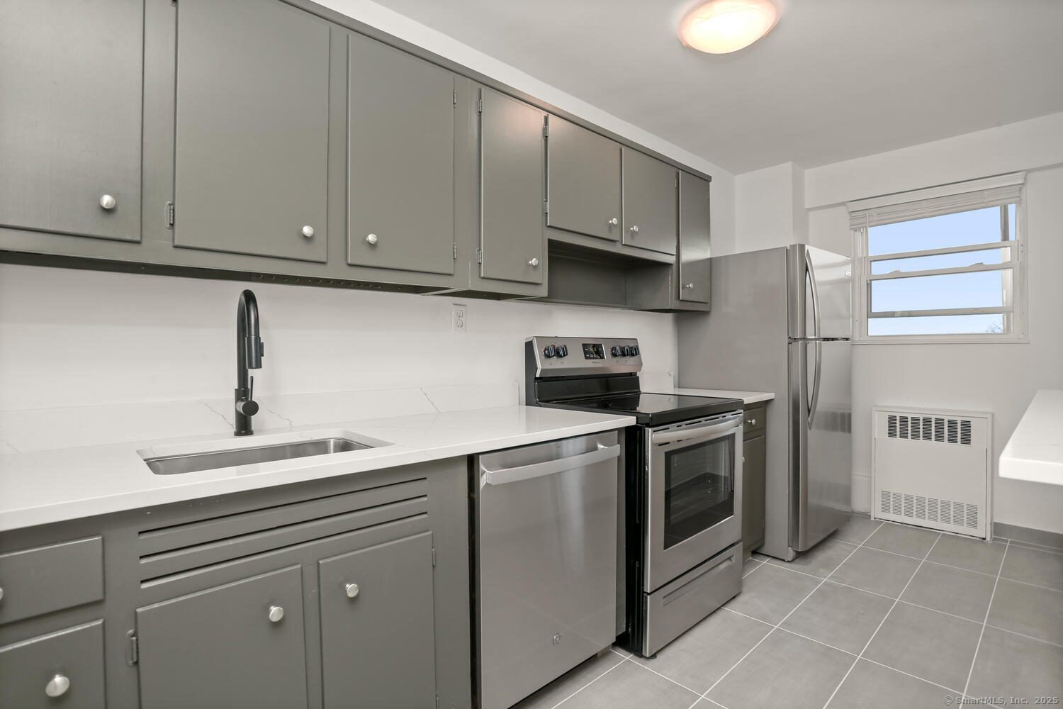 80 Cartright Street, Unit 8B Bridgeport, CT 06604 - Photo 4 of 14 a kitchen with cabinets and appliances