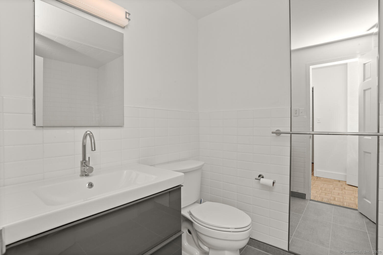 80 Cartright Street, Unit 8B Bridgeport, CT 06604 - Photo 9 of 14 a bathroom with a sink a toilet and shower