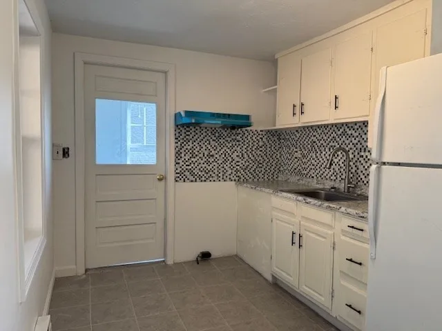 a utility room with cabinets