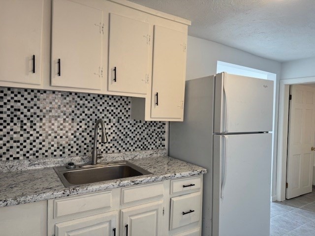 20 Ayer Road Shirley, MA 01464 - Photo 15 of 19 a kitchen with a refrigerator and cabinets