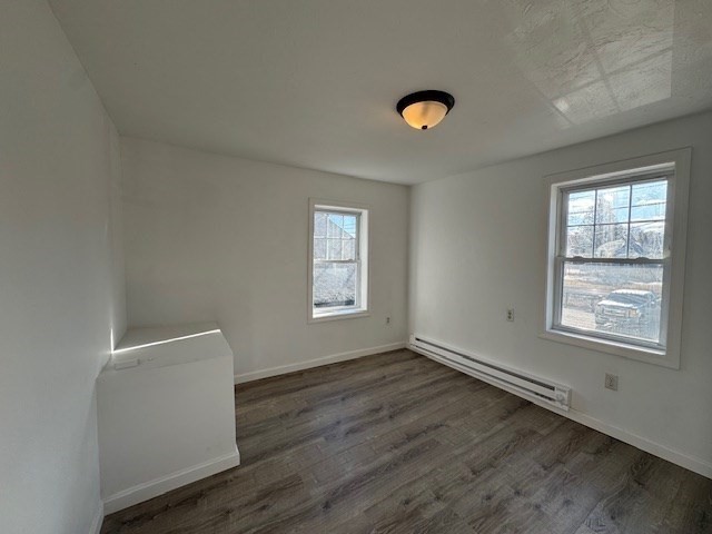 20 Ayer Road Shirley, MA 01464 - Photo 8 of 19 an empty room with wooden floor and windows