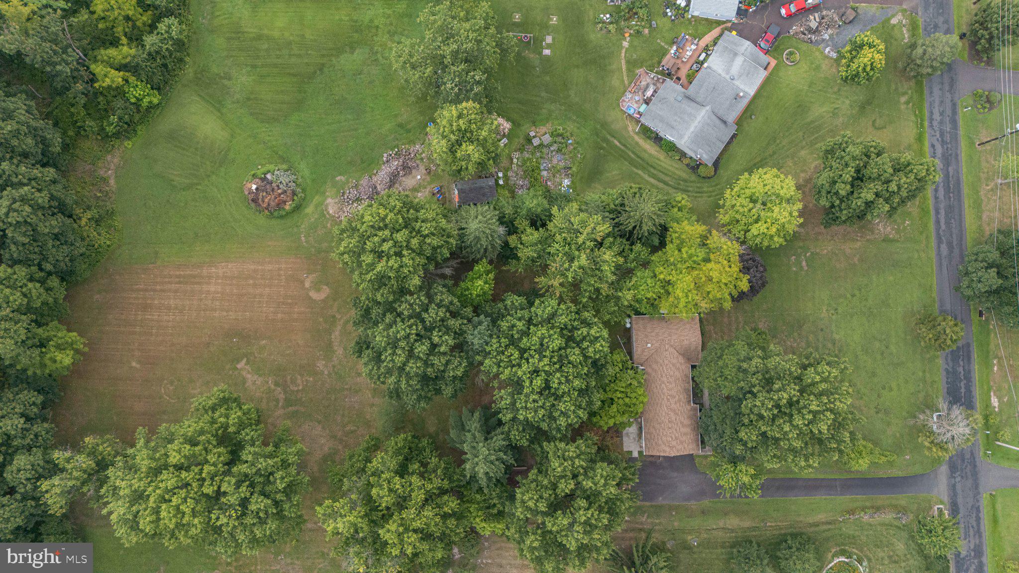 130 Webber Road Telford, PA 18969 - Photo 49 of 52 Lush greenery surrounds a cozy home.