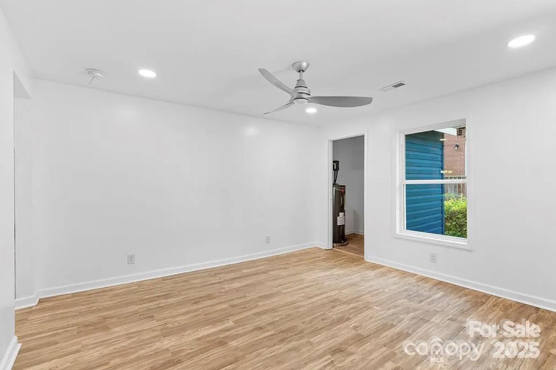 332 Mountain View Street Gastonia, NC 28052 - Photo 2 of 8 a view of an empty room with a window