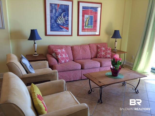 27284 Gulf Road, Unit 404 Orange Beach, AL 36561 - Photo 9 of 23 Plenty of seating. Sofa pulls out to queen size bed; 3 comfortable chairs; flat screen TV