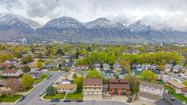 630 1100 West Provo, UT 84601 - Photo 63 of 64 Residential area with varied architectural styles and mature trees against a backdrop of snow-capped mountains