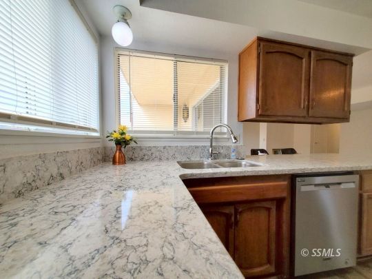 732 West Alene Avenue Ridgecrest, CA 93555 - Photo 15 of 38 a kitchen with sink a window and cabinets