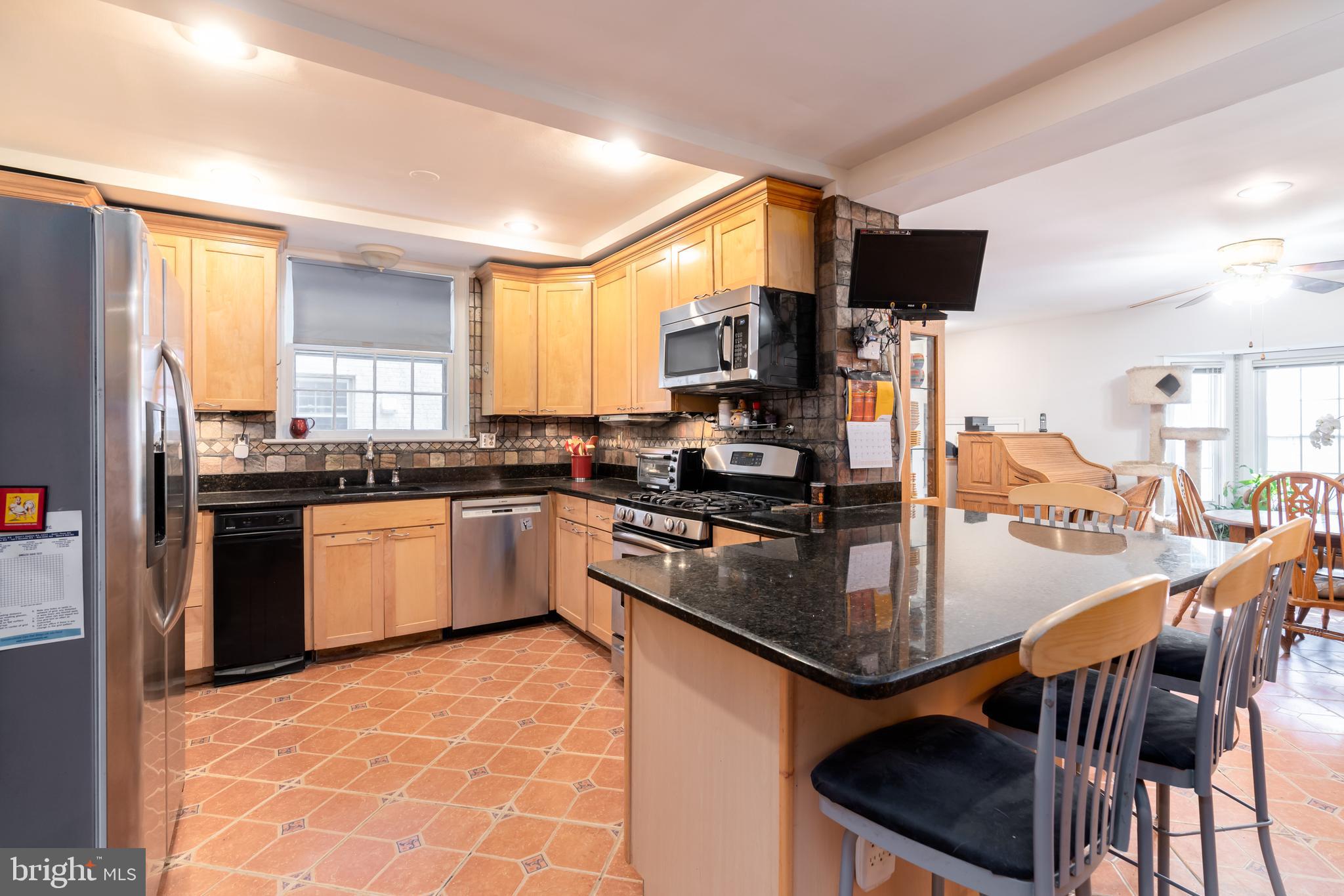 5016 Reno Road Northwest Washington, DC 20008 - Photo 11 of 38 Expansive dining area with counter seating for 4.