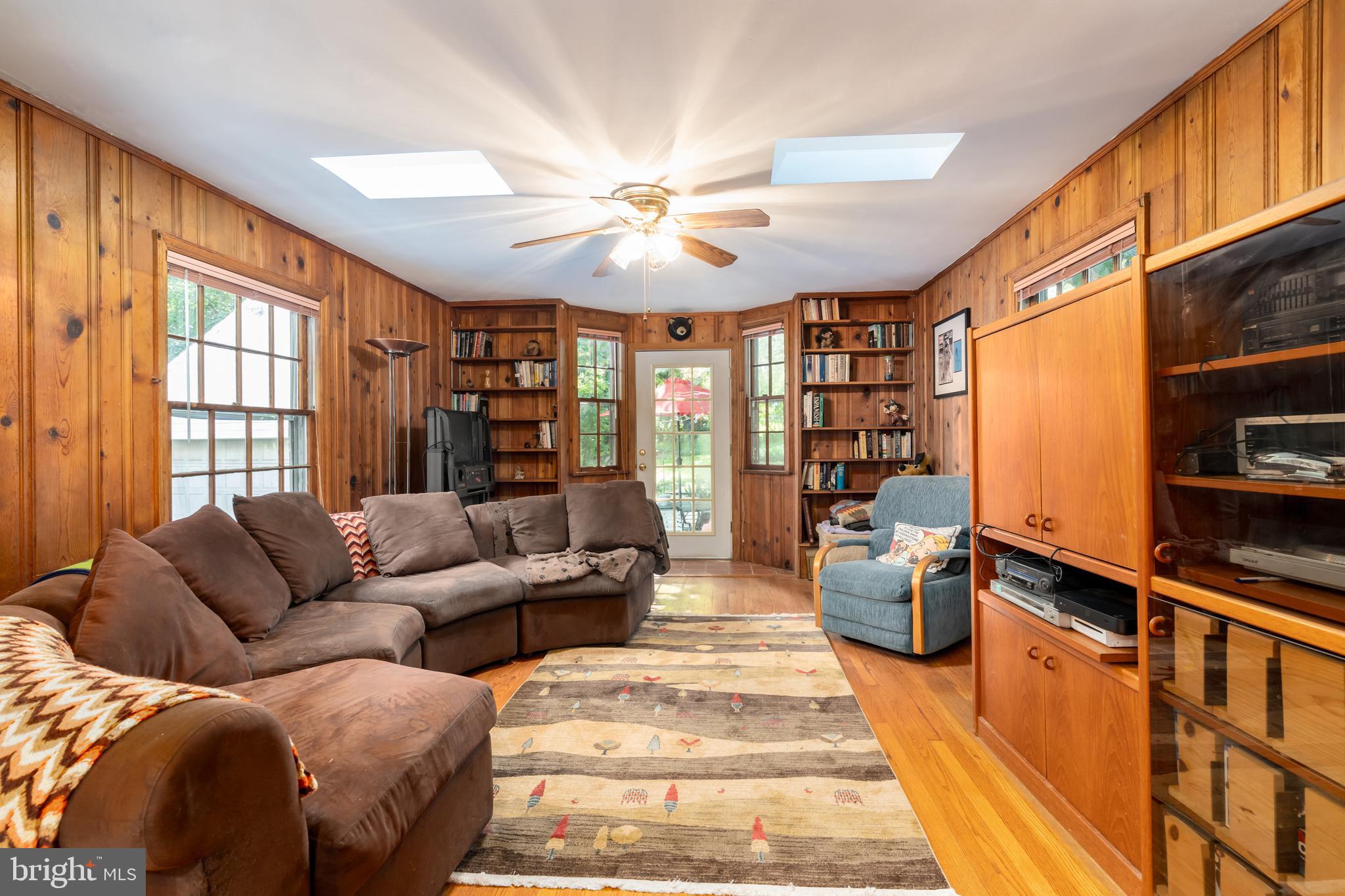 5016 Reno Road Northwest Washington, DC 20008 - Photo 16 of 38 Family room boasts built-ins and patio access.