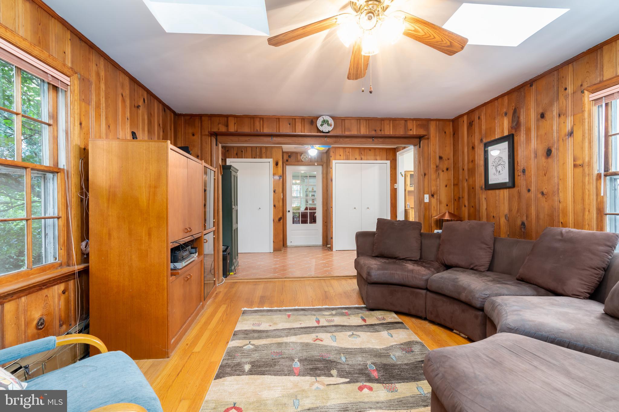 5016 Reno Road Northwest Washington, DC 20008 - Photo 17 of 38 Wood paneling and hardwood floors add warmth