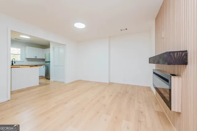 a kitchen with granite countertop cabinets and oven