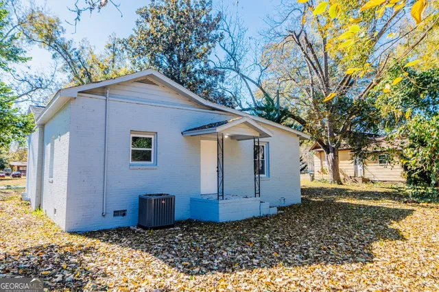 a house with a tree in the background