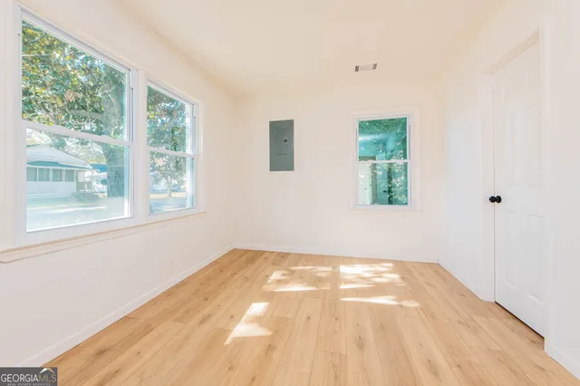 a view of an empty room with a window
