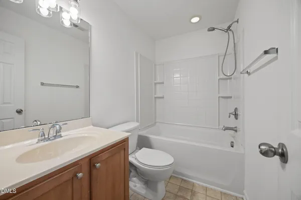 a bathroom with a sink toilet tub and shower