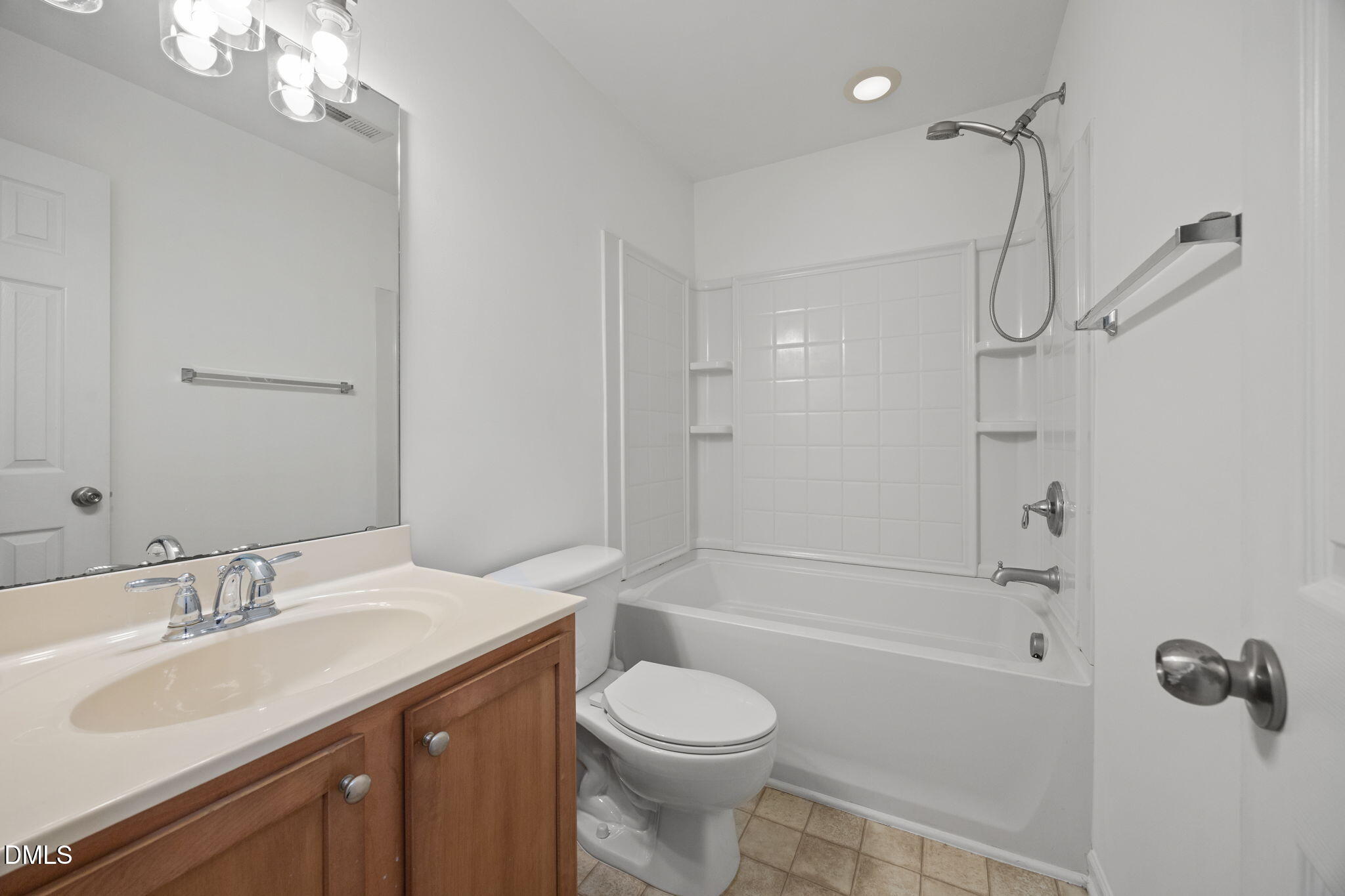 1111 Consortium Drive, Unit 109 Raleigh, NC 27603 - Photo 13 of 30 a bathroom with a sink toilet tub and shower