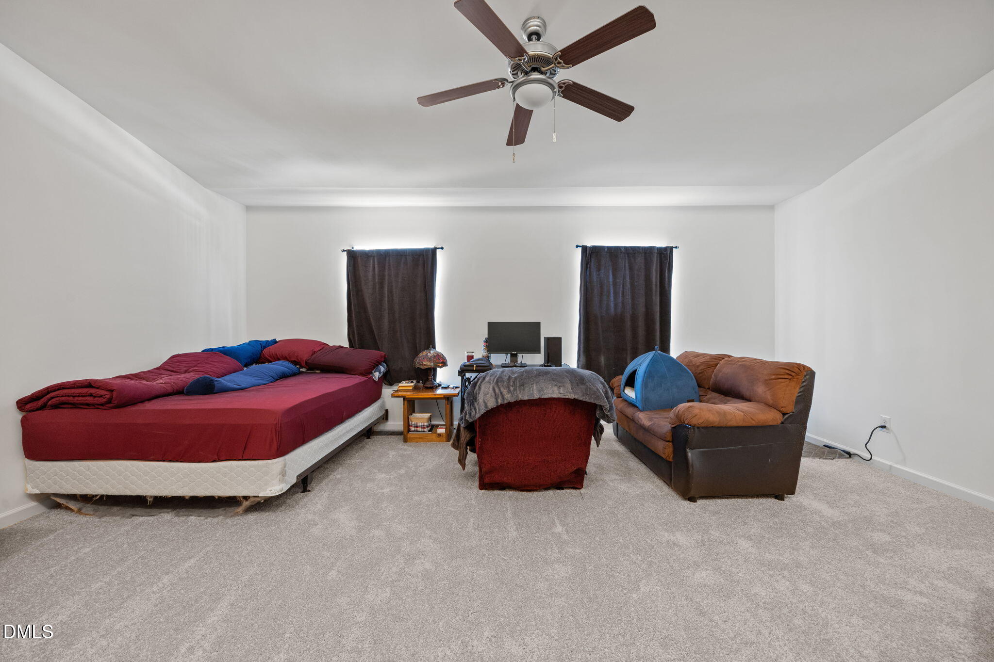 1111 Consortium Drive, Unit 109 Raleigh, NC 27603 - Photo 14 of 30 a bedroom with bed and window