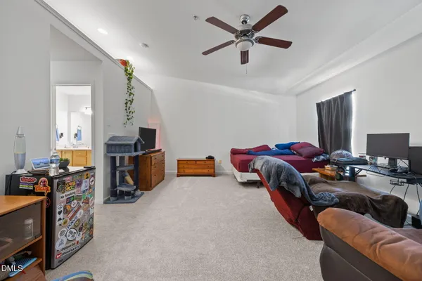 a bed room with a bed furniture and a flat screen tv