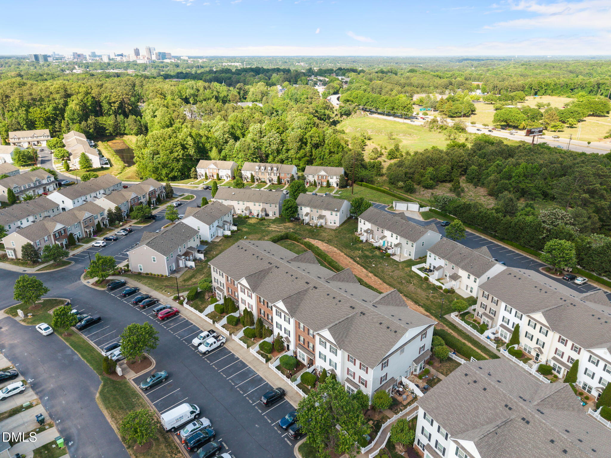 1111 Consortium Drive, Unit 109 Raleigh, NC 27603 - Photo 24 of 30 an aerial view of a city with lots of residential buildings