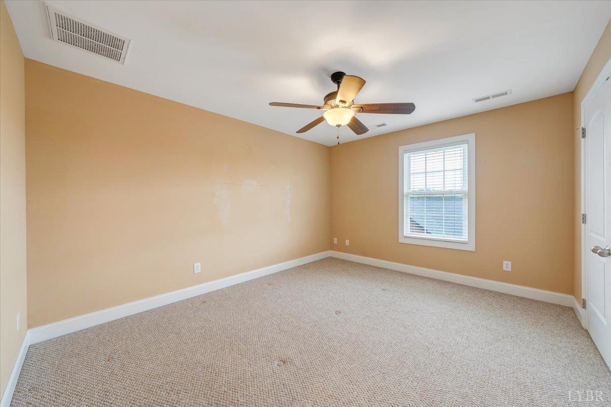 1250 Our Cove Road Huddleston, VA 24104 - Photo 41 of 70 a view of an empty room with a window