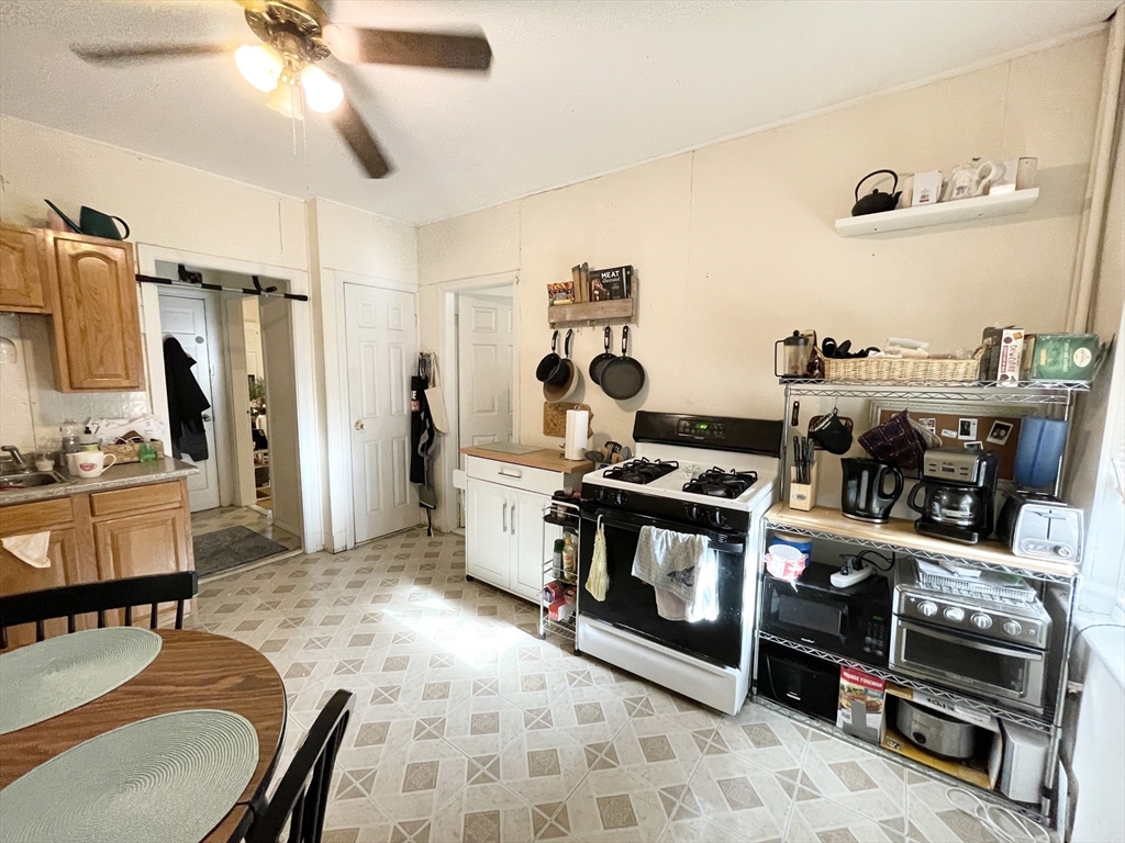 20 Howell Street, Unit 1 Boston, MA 02125 - Photo 2 of 10 a room with furniture and a flat screen tv