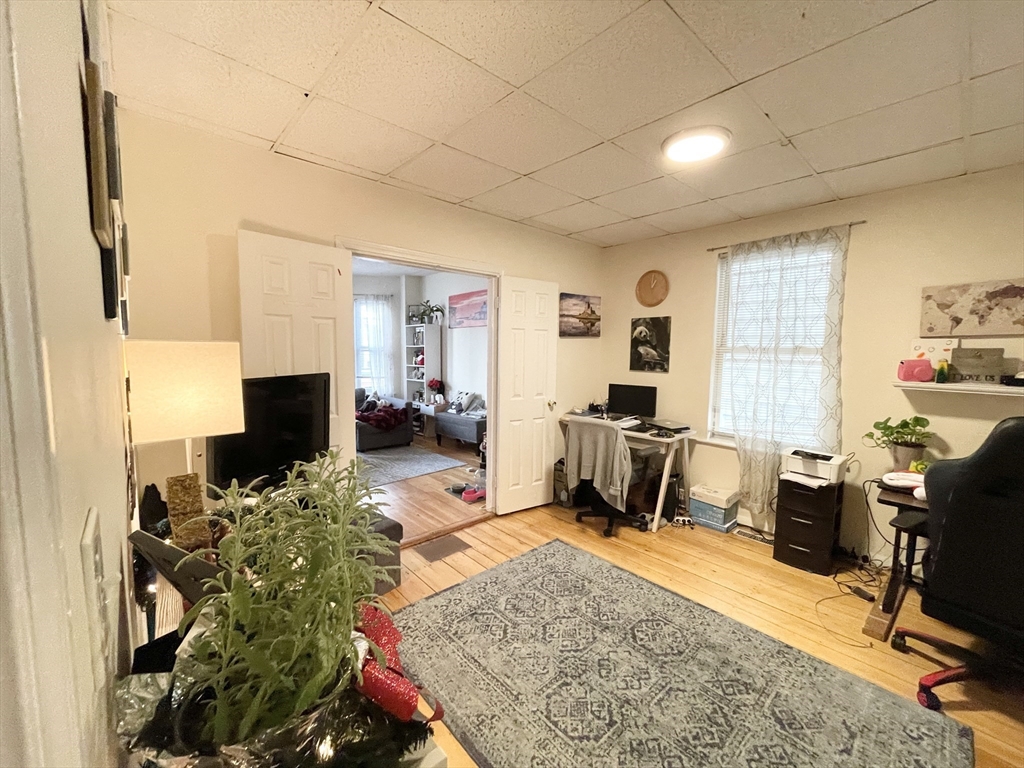 20 Howell Street, Unit 1 Boston, MA 02125 - Photo 4 of 10 a workspace with furniture workspace and a window
