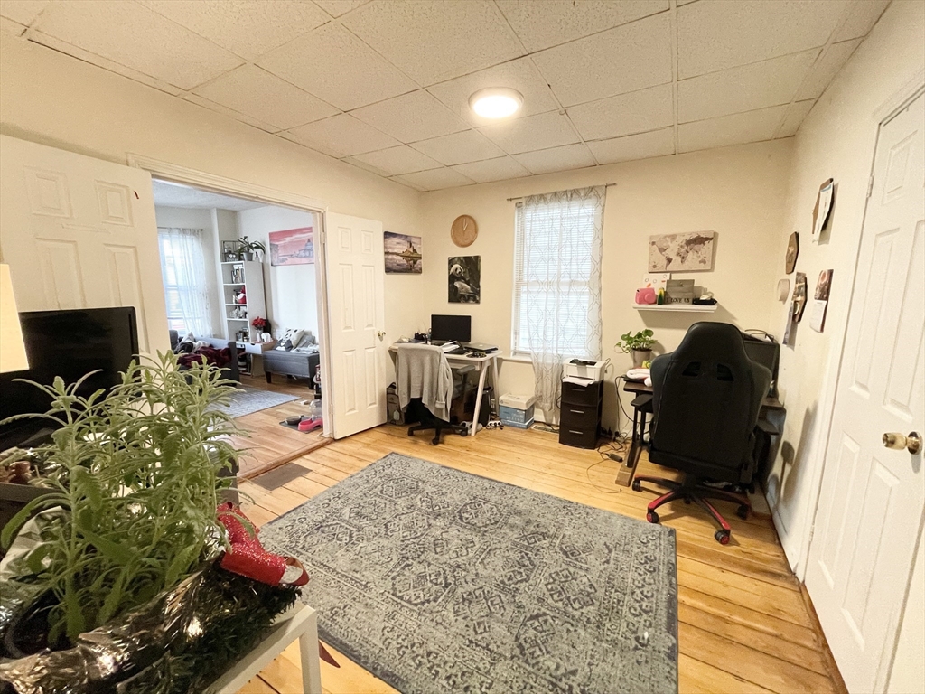 20 Howell Street, Unit 1 Boston, MA 02125 - Photo 5 of 10 a view of a livingroom with workspace and a couch