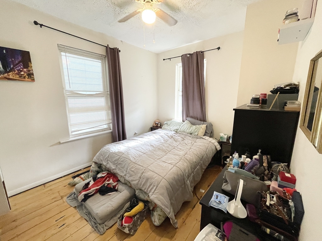 20 Howell Street, Unit 1 Boston, MA 02125 - Photo 6 of 10 a bedroom with a bed and a window