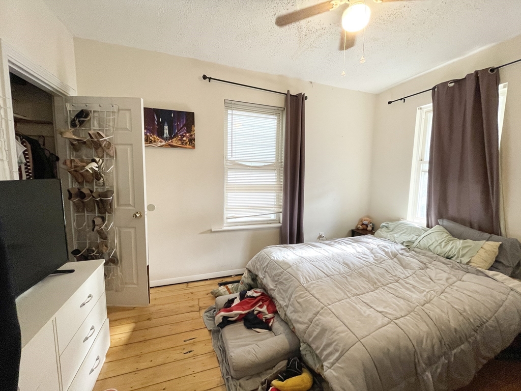 20 Howell Street, Unit 1 Boston, MA 02125 - Photo 7 of 10 a bedroom with a bed and a window