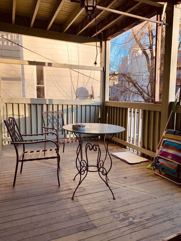 20 Howell Street, Unit 1 Boston, MA 02125 - Photo 9 of 10 a view of balcony with wooden floor and outdoor seating
