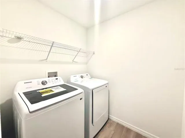 a utility room with dryer and washer