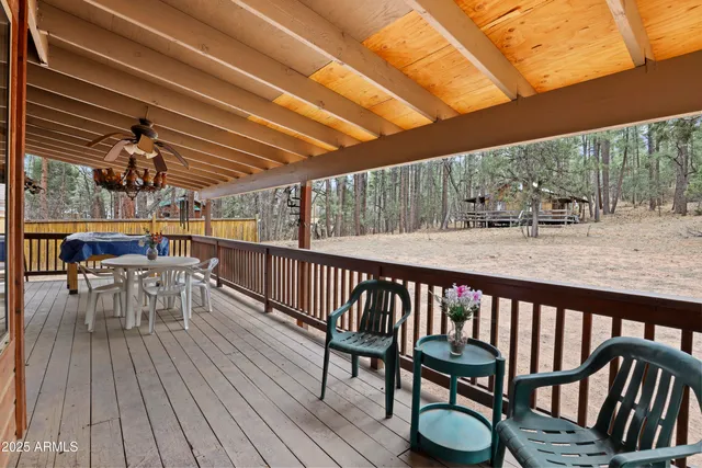 a view of a chairs and table in the balcony