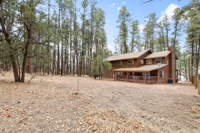 a view of house with a yard in front of it